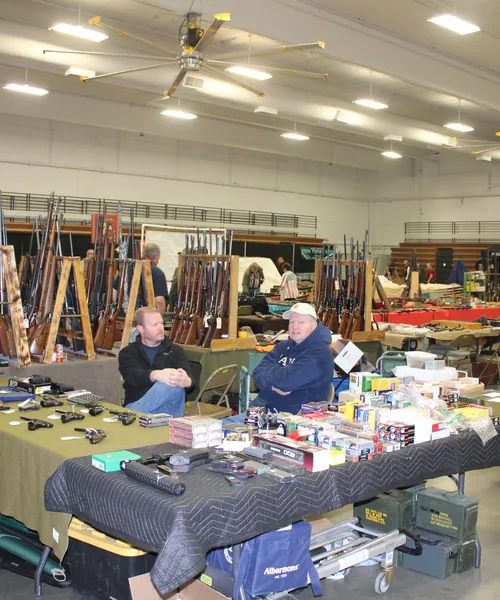 Holsters, optics and hunting gear on a vendor display