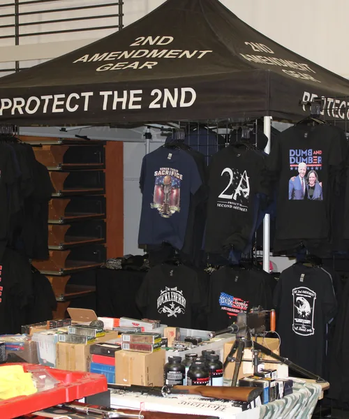 Attendees browsing the gun show floor