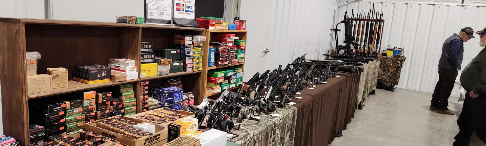 Ammunition, reloading supplies and firearms on display at a gun show
